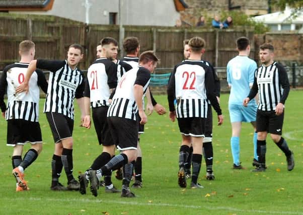 Newburgh head back to the centre circle after finding the net...again. Pic by Graham Strachan.