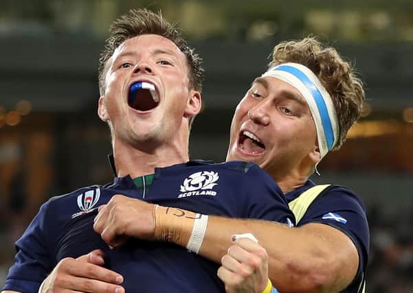 George Horne of Scotland celebrates scoring his team's seventh try with Jamie Ritchie of Scotland during the Rugby World Cup 2019 Group A game between Scotland and Russia . (Photo by Mike Hewitt/Getty Images)