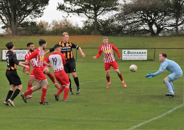 Newburgh heap more pressure on the Lochgelly goal. Pic by Graham Strachan.
