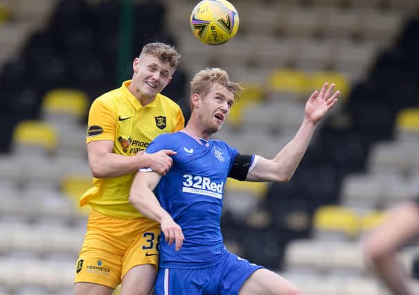 LIVINGSTON, SCOTLAND - AUGUST 16: Jack Hamilton of Livingston  battles for possession with Filip Helander of Rangers FC  during the Ladbrokes Scottish Premiership match between Livingston and Rangers at Tony Macaroni Arena on August 16, 2020 in Livingston, Scotland. (Photo by Willie Vass/Pool via Getty Images)