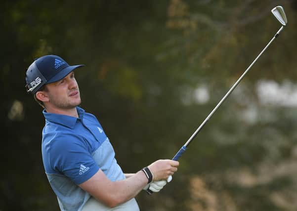 Connor Syme  tees off on the fourth tee during day one of the DP World Tour Championship at Jumeirah Golf Estates on December 10, 2020 in Dubai, United Arab Emirates. (Photo by Ross Kinnaird/Getty Images)