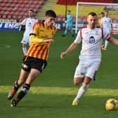 Kevin Smith closes down Partick's Ryan Williamson.