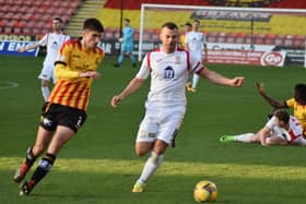 Kevin Smith closes down Partick's Ryan Williamson.