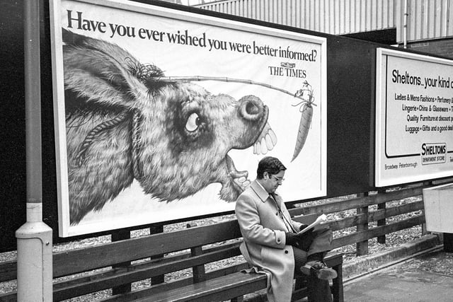 The picture, from 1981, shows Bernard Norman waiting for a train at Peterborough railway station. Chris Porsz spotted him underneath an advert for The Times newspaper featuring a donkey trying to nibble a dangling carrot. At the time of the original photo, Bernard was working as director of retail operations for Thomas Cook, based in Peterborough, but commuted to London three times a week.