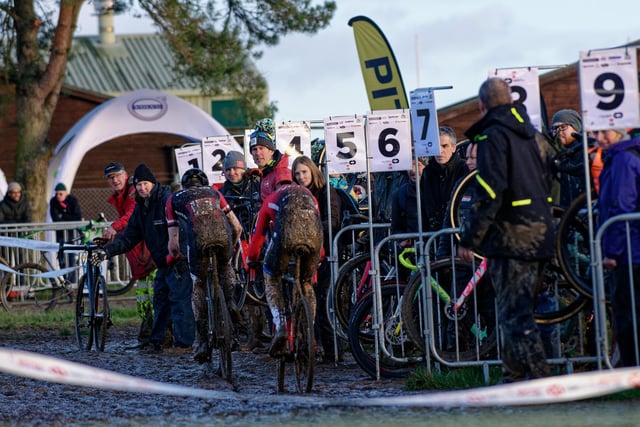 Spectators get a glimpse of the mud-flecked competitors