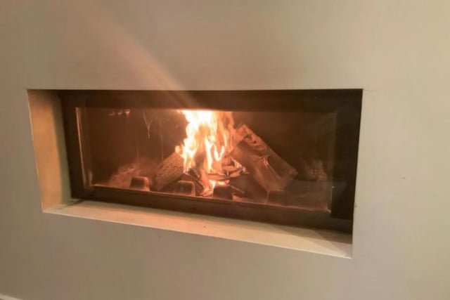 The toasty wood burning fireplace in the living room