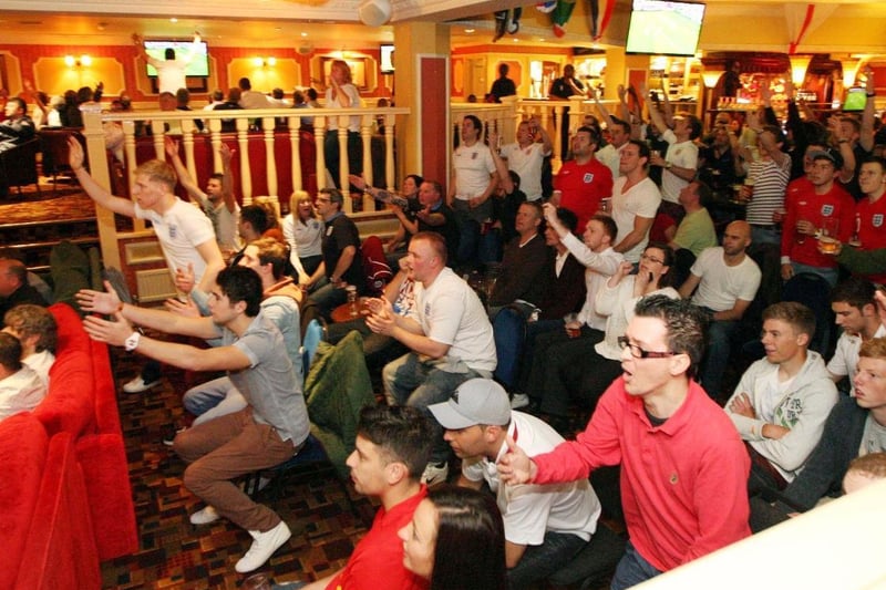 The crowd are on their feet at the Barratt Club in Northampton during the England-France game