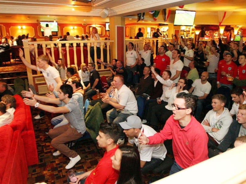 The crowd are on their feet at the Barratt Club in Northampton during the England-France game