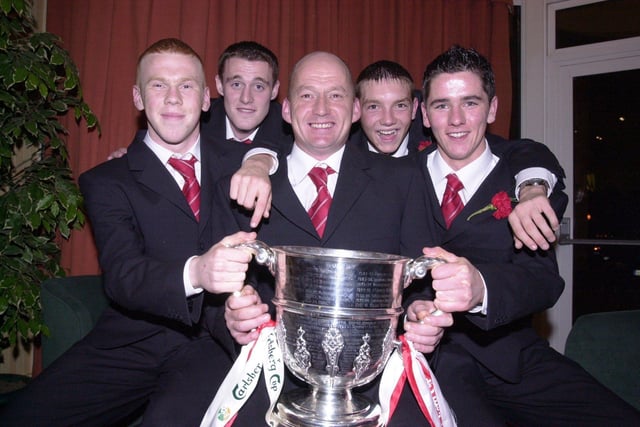 Gareth Mullan, Gary Ramsey, Paul 'Oxo' McLaughlin, Kevin Deery and Gareth McGlynn celebrate Derry City's 2002 FAI Cup win over Shamrock Rovers.