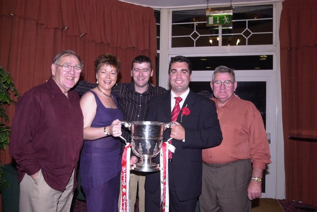 The Doherty family celebrate the cup win. From left, Larry, Dara, Lorcan, Gavin and Brian.