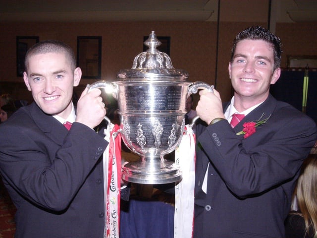 Borthers Tommy and Eddie McCallion holding the FAI Cup trophy, following their win over Shamrock Rovers.