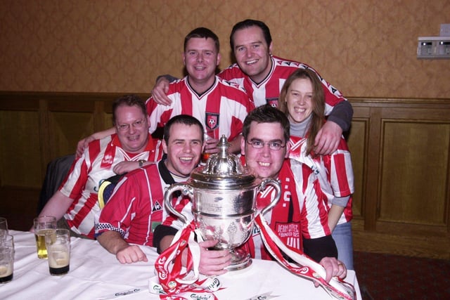 Derry City fans pictured with the FAI Cup after the Candy Stripes' victory at Tolka Park.