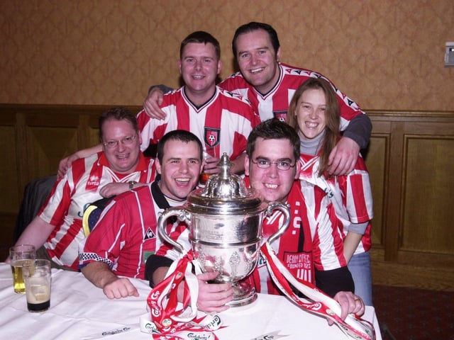 Derry City fans pictured with the FAI Cup after the Candy Stripes' victory at Tolka Park.