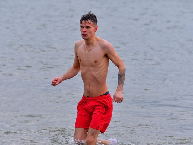Braving the elements at the annual Christmas Day swim at Ludden beach, Buncrana. Photo: George Sweeney. DER2151GS – 014