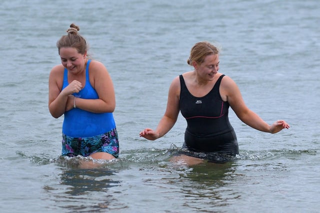 Two brave ladies take part in the annual Christmas Day swim at Ludden beach, Buncrana. Photo: George Sweeney.  DER2151GS – 016