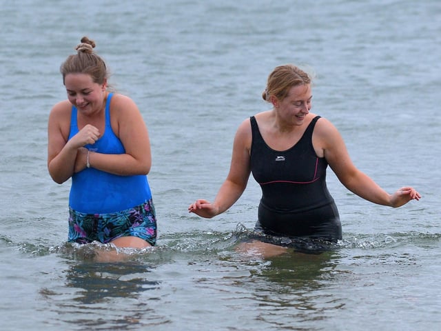 Two brave ladies take part in the annual Christmas Day swim at Ludden beach, Buncrana. Photo: George Sweeney. DER2151GS – 016