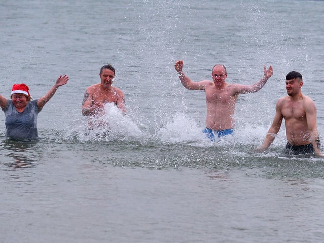 Enjoying a dip in Lough Swilly at the annual Christmas Day swim at Ludden beach, Buncrana. Photo: George Sweeney. DER2151GS – 019