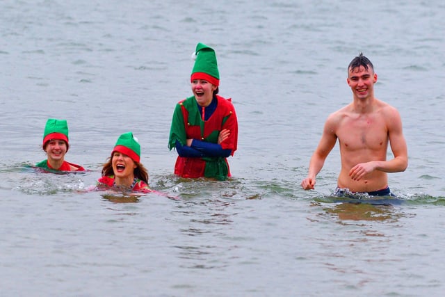 Derry locals supporting Foyle Hospice at the annual Christmas Day swim at Ludden beach, Buncrana. Photo: George Sweeney.  DER2151GS – 026