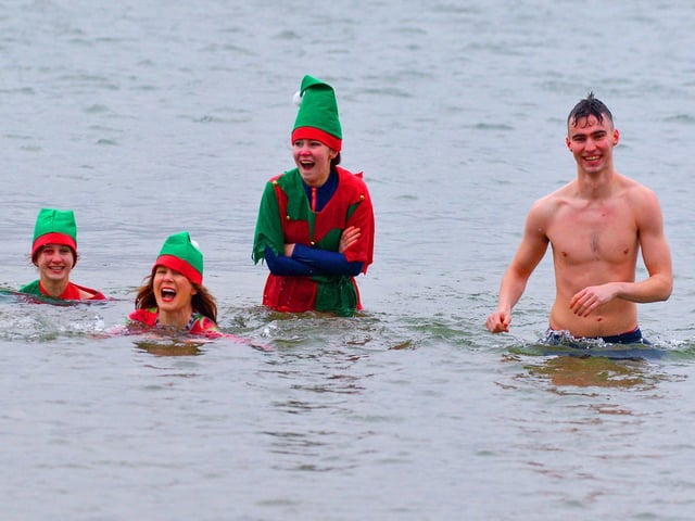 Derry locals supporting Foyle Hospice at the annual Christmas Day swim at Ludden beach, Buncrana. Photo: George Sweeney. DER2151GS – 026