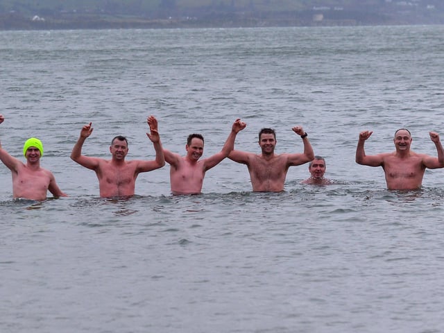 Buncrana men defy the freezing conditions to take part in the annual Christmas Day swim at Ludden beach. Photo: George Sweeney. DER2151GS – 018