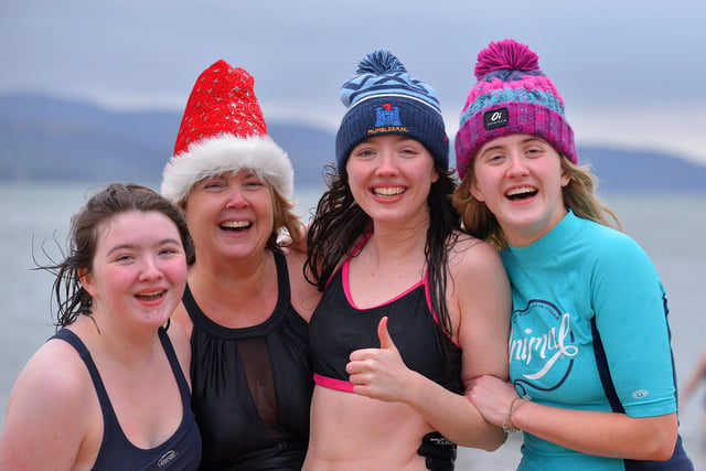 Derry girls Lauren, Sarah, Jeanette and Katelyn pictured at the annual Christmas Day swim at Ludden beach, Buncrana. Photo: George Sweeney.  DER2151GS – 028
