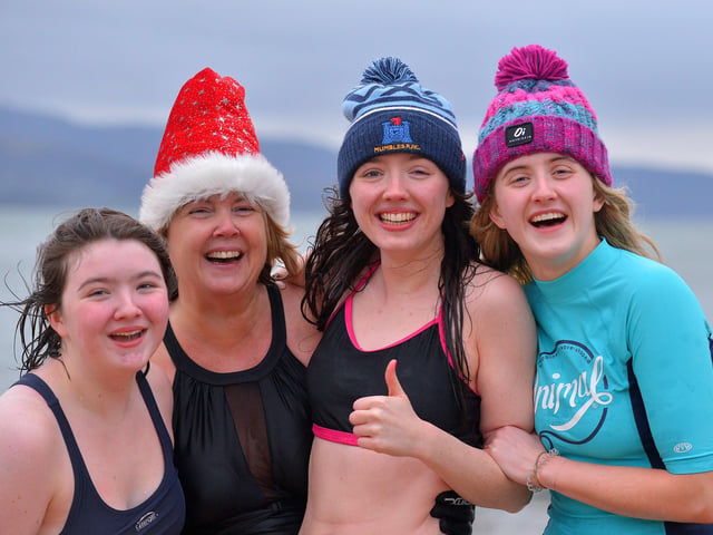 Derry girls Lauren, Sarah, Jeanette and Katelyn pictured at the annual Christmas Day swim at Ludden beach, Buncrana. Photo: George Sweeney. DER2151GS – 028