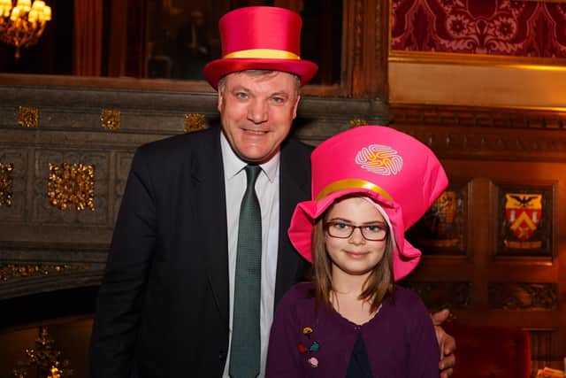 Maisie with Ed Balls at a charity fundraiser.