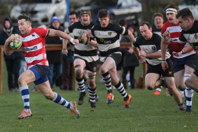 Jack Todd races away from Perthshire defence to set up Cameron Walker's try. Pic by Chris Reekie Photography