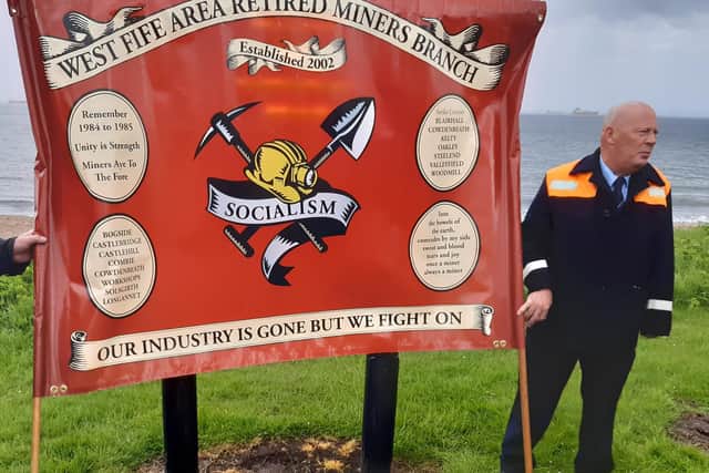Wreaths were laid below the miners' banner to mark the 50th anniversary of the Seafield disaster