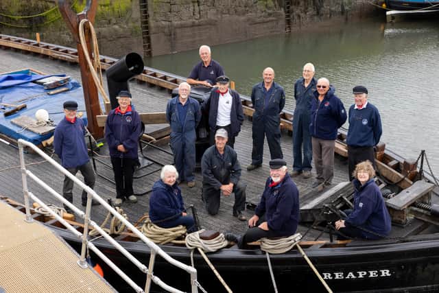 Scottish Fisheries Museum’s iconic ‘Fifie’ the Reaper.
Scottish Fisheries Boat Club.
Top to bottom, left to right: The Reaper Skipper Mike Barton, Nick Chalmers, Tony Davis, Winston Stewart, Coull Deas MBE, Bob Flan, Donald McDonald, Dave Crowther, Rodger McAslan, Andrew Gould, Sadie Crowther, Jim Wilson, Lesley McConnell
 Volunteers at the Scottish Fisheries Museum’s Boat Club, which help maintain and sail Reaper, have so far contributed over 700 hours to the final phase of the £1million conservation, working on the internal refit, reinstating the cabins, galley, display areas and navigational aids.
Photograph by Martin Shields