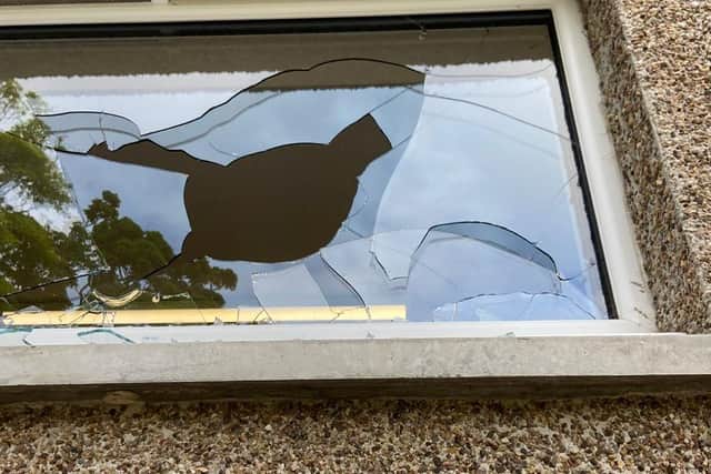 One of the smashed windows at the club.