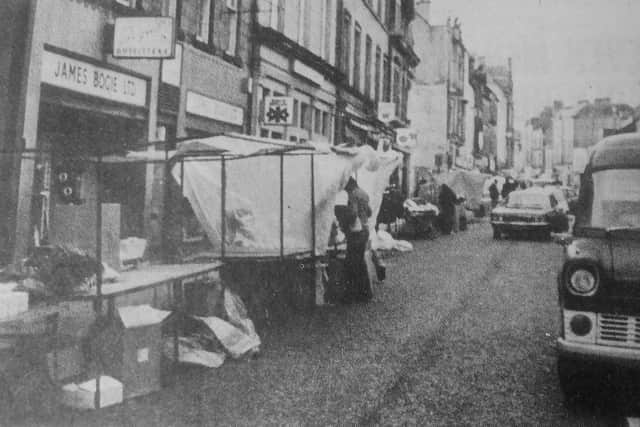 Kirkcaldy High Street, November 1977 - over 100 market traders  set up stalls along Kirkcaldy High Street, causing  chaotic scenes.