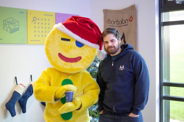 Modern Standard Coffee general manager, Fraser Rankin, with Fife Gingerbread mascot, Gingey, at the roastery in Glenrothes.