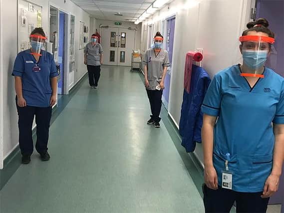 Staff at Perth Royal Infirmary wearing the PPE kit from Fife College