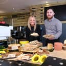 Tracy McCafferty, Venue Manager at Dunfermline Carnegie Library & Galleries, and Kieran Conner, OWI business development manager, with some of the tasty offerings now being served up in The Granary.