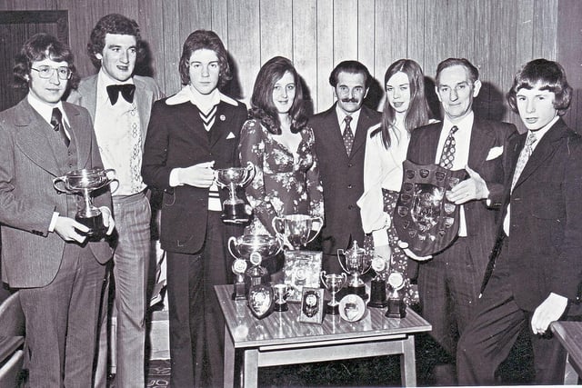 This is from the early 1970s,  and shows the prizewinners at Kennoway Road Club.
 Pictured (centre) are Margaret Anderson, leisure and recreation officer with Kirkcaldy District Council, and Councillor Charles Gardner, chairman of the council's leisure and recreation committee. Others in the picture are, (from left) Messrs Munro, Henderson and Stenhouse, (then Mrs Anderson and Cllr Gardner) Ms Cramb, and Messrs Nicol and Dye. 
The picture was taken by A. James Price (Press Photographer), Kennoway.