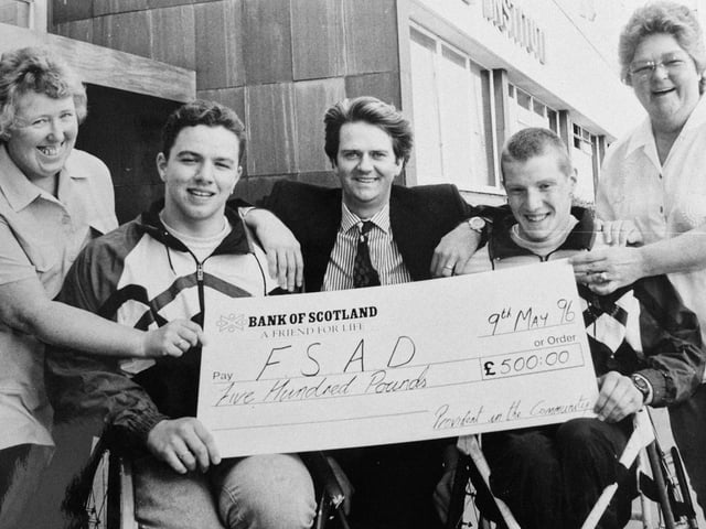 A 1996 cheque presentation to Fife Sports Association for the Disabled at Fife Institute, Glenrothes. Pictured from left are: Anne Wighton, Kenny Suttie, John Doyle, Derek Frew and Rae Swift. The picture was taken by a staff photographer from the Fife Free Press.