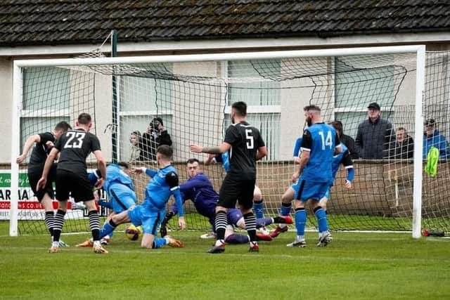 Mikey Ness, 1st left, scores K & D's first goal at St Andrews