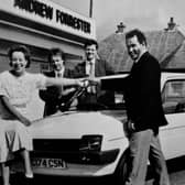 A car winner in 1986 collects her prize from Andrew Forrester in Glenrothes.