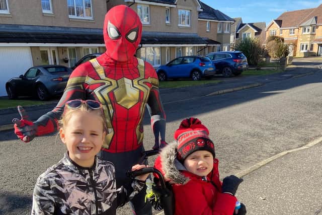 Duloch Spiderman Dave Roper with his children Lucy and Liam