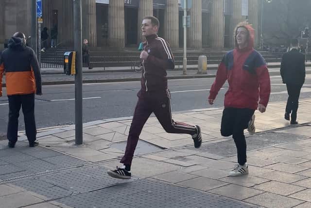 Lewis and Forbes running along Princes Street on Monday, January 15. Photo by Rebeka Thomson.
