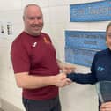 Swimmer Erin Taylor being given her Kirkcaldy and Central Fife Sports Council awards by her coach Ian Lewis at Kirkcaldy Pool