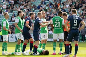 Referee Nick Walsh shows Raith Rovers' Liam Dick a red card during Sunday's Viaplay Cup second round game against Hibs at Easter Road (Pic by Ross Parker/SNS Group)