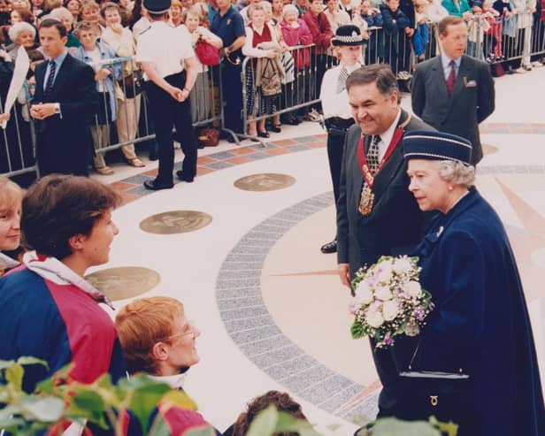 The Queen came to Glenrothes in 1998 for the town's 50th anniversary celebrations. She is pictured with Councillor John MacDougall, leader of Fife Council, talking to crowds in the Kingdom Centre.