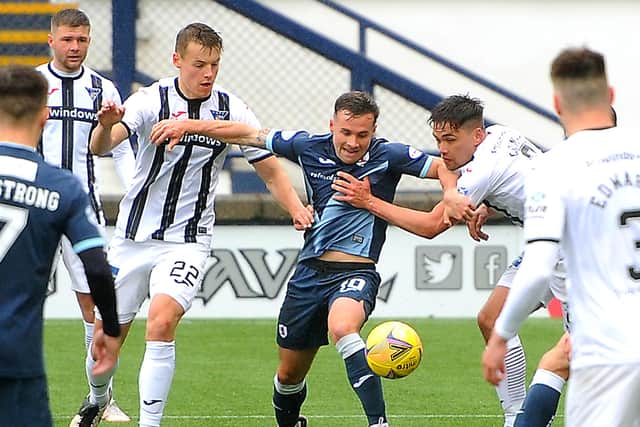 Vaughan tussles with the Pars' defence.