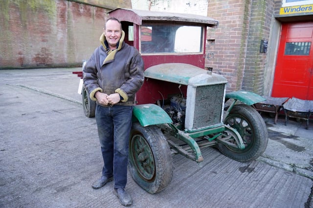 Owner Stuart Mills with a recent acquisition - an original vehicle which he hopes to restore.