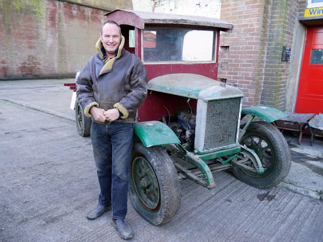 Owner Stuart Mills with a recent acquisition - an original vehicle which he hopes to restore.