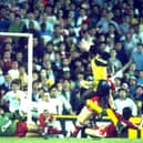 Michael Thomas of Arsenal (right) beats Liverpool goalkeeper Bruce Grobbelaar to score title clinching goal at Anfield on May 26, 1989 (Pic by Allsport UK)