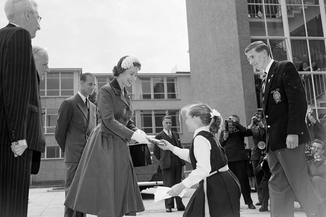 The Queen receives a diary from Janette Davidson on her visit to Kirkcaldy High School.