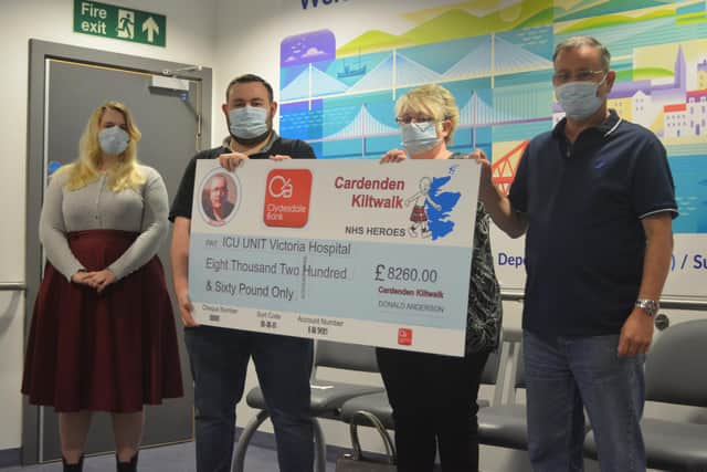 Friends and family of Craig Abercrombie with their bumper donation to the ICU ward